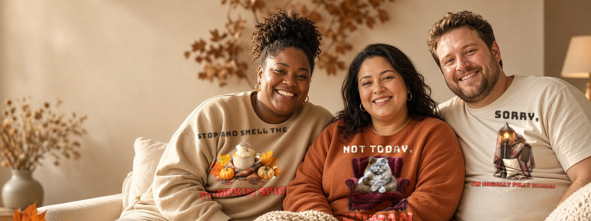 Friends in Inkida plus size sweatshirts and tees on a cozy sofa